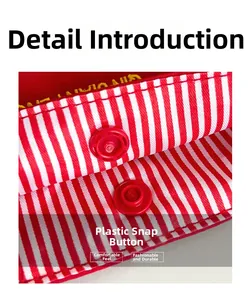 Macro detail of red plastic snap button closure on striped canvas tote bag fabric