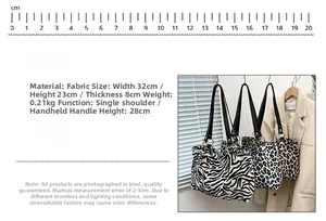 Detailed size chart of zebra pattern canvas tote showing 32x23x8cm dimensions and strap height