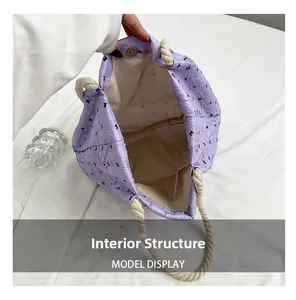 Internal structure of purple quilted tote bag showing large capacity and inner pocket