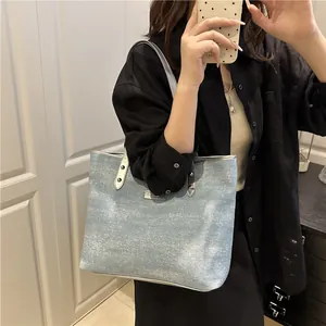 Large glitter blue tote bag for women with silver trim and metallic logo detail