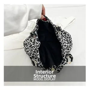 Internal structure showing black lining and large capacity of zebra pattern tote bag