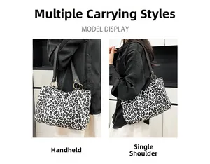 Zebra pattern tote bag showing versatile handheld and shoulder carry options