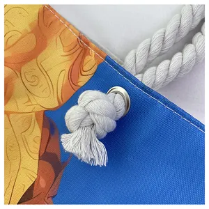 Detailed close-up of canvas texture with sturdy white cotton rope handle and metal eyelets