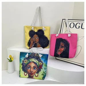 Three canvas tote bags with colorful African female art prints and thick rope handles