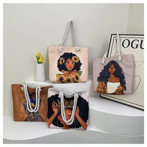 Detail of canvas tote bags with artistic black woman prints and soft cotton rope handles