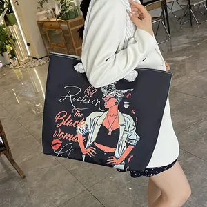 Stylish black canvas tote bag with fashion print and thick rope handles for women