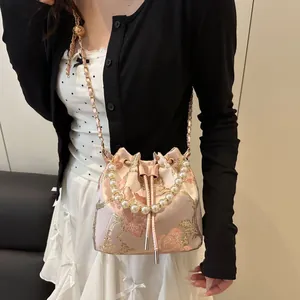 Elegant pink floral embroidered bucket bag with pearl handle and chain strap for women