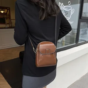 Retro brown PU leather crossbody phone bag for women with adjustable strap in street style