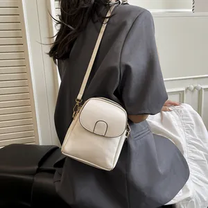 Chic beige PU leather vertical crossbody phone bag for women with gold hardware