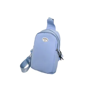 Light blue nylon crossbody chest bag with adjustable strap and brand logo patch