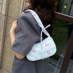 Floral light blue shoulder bag with pink roses and bow prints in sweet vintage style