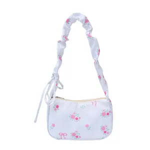 Floral canvas shoulder bag with pink roses and ruffled strap for women