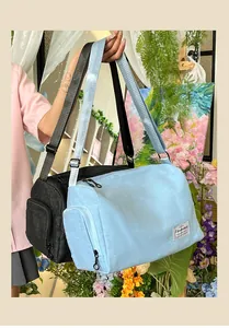 Large canvas travel tote bag with adjustable shoulder straps and side zipper pocket