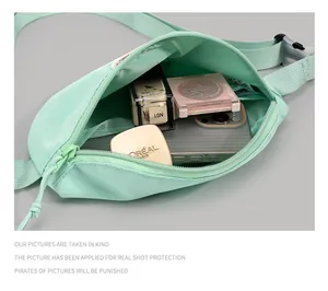Spacious interior of mint green crossbody bag showing daily essentials and phone