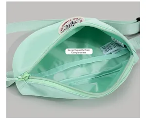 Detailed interior view showing large capacity main compartment of mint green canvas bag