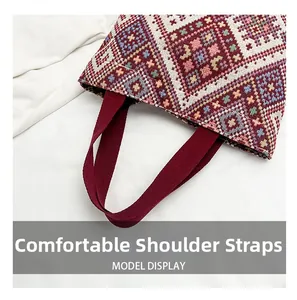 Close-up of ethnic geometric pattern tote bag with wide burgundy comfortable shoulder straps