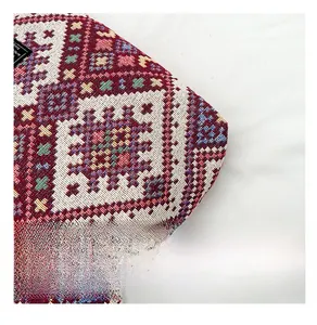 Detailed close-up of Bohemian jacquard woven fabric with intricate ethnic patterns