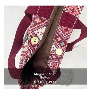 Detail shot of the ethnic tote bag featuring secure magnetic snaps and colorful weaving
