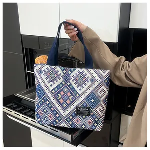 Close-up of ethnic tote bag with geometric patterns and durable webbing handles