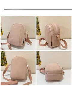 Detail views of pink nylon crossbody bag with dual zippers and adjustable shoulder strap