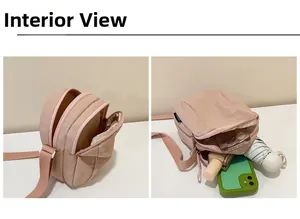 Interior display of pink nylon crossbody bag showing three layered zipper compartments