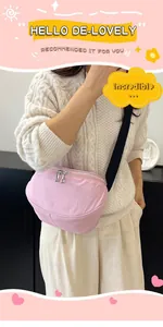 Close-up of a light pink nylon crescent crossbody bag with double zippers and black strap