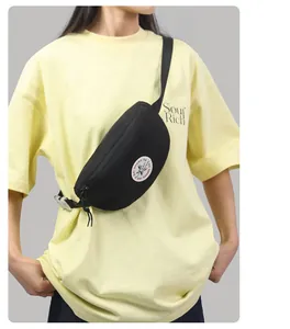 Close-up of black nylon waist bag featuring a white circular star logo on the front