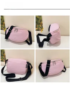 Four views of a pink canvas saddle bag showing double zippers and adjustable strap