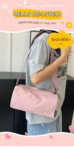 Pink nylon barrel bag detail showing the wide strap and brand label on shoulder