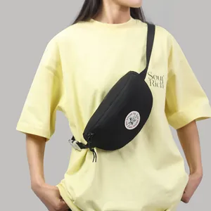 Japanese style black nylon chest bag with round embroidered badge and adjustable strap
