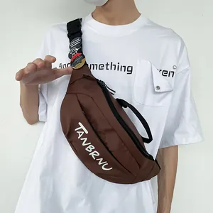 Minimalist coffee brown crossbody chest bag with Tanbrnu lettering and badges