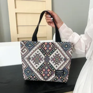Ethnic knit tote bag with geometric patterns and black handles for women