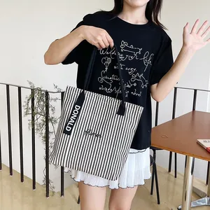 Classic striped canvas tote bag with black letter embroidery and wide woven handles