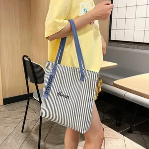 Striped canvas tote bag for women with blue and white stripes and Humin embroidery