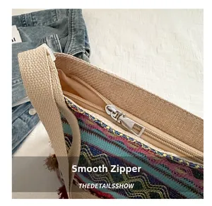 Detail view of ethnic tote featuring a smooth silver zipper and colorful woven pattern