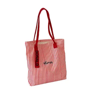 Large red striped canvas tote bag with Humin embroidery and red shoulder straps