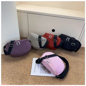 Five assorted colors of nylon crescent saddle bags with adjustable black straps