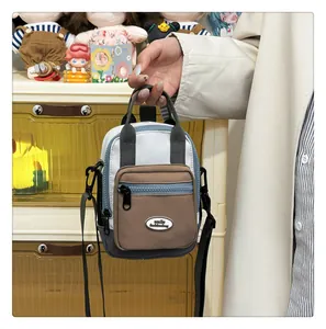 Detailed shot of multi-color crossbody mini bag featuring a smile fashionbag leather logo