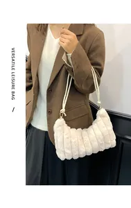 Detailed texture of off-white plush shoulder bag with vertical stripe pleated patterns