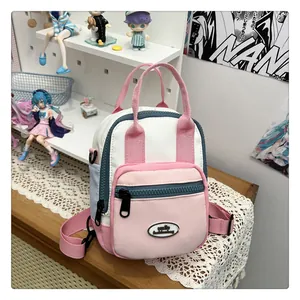 Close-up of color-block nylon backpack with smile fashionbag logo and zip pocket