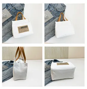 Vues détaillées du sac fourre-tout en toile blanche avec anses et fermeture éclair