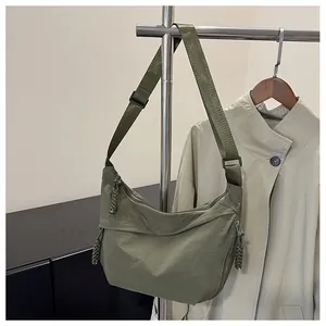 Detailed macro view of olive green nylon bag texture with woven rope zipper pull