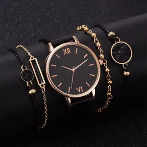 Detail of elegant black quartz watch set with three matching rose gold rose bracelets