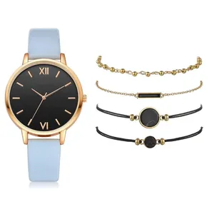 Women's quartz watch set with light blue PU strap and four matching gold bracelets
