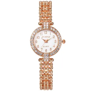 Elegante roségoldene Damen Quarzuhr mit Strass-Lünette und Kugelarmband aus Metall