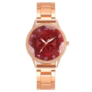Detail of rose gold quartz watch featuring a red sunray dial with petal texture