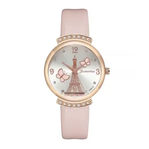 Close-up of pink leather watch dial featuring Eiffel Tower and butterfly designs