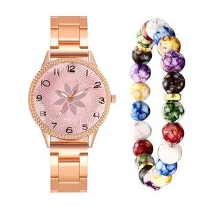 Detail of rose gold floral watch with multi-colored marble beaded bracelet set