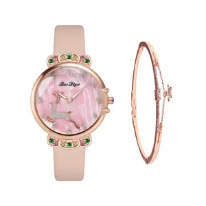 Detail of pink leather watch with multi-colored crystals, deer dial and star bracelet