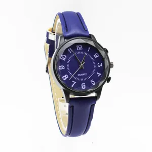 Detail view of a minimalist quartz watch with dark blue leather strap and black matte case